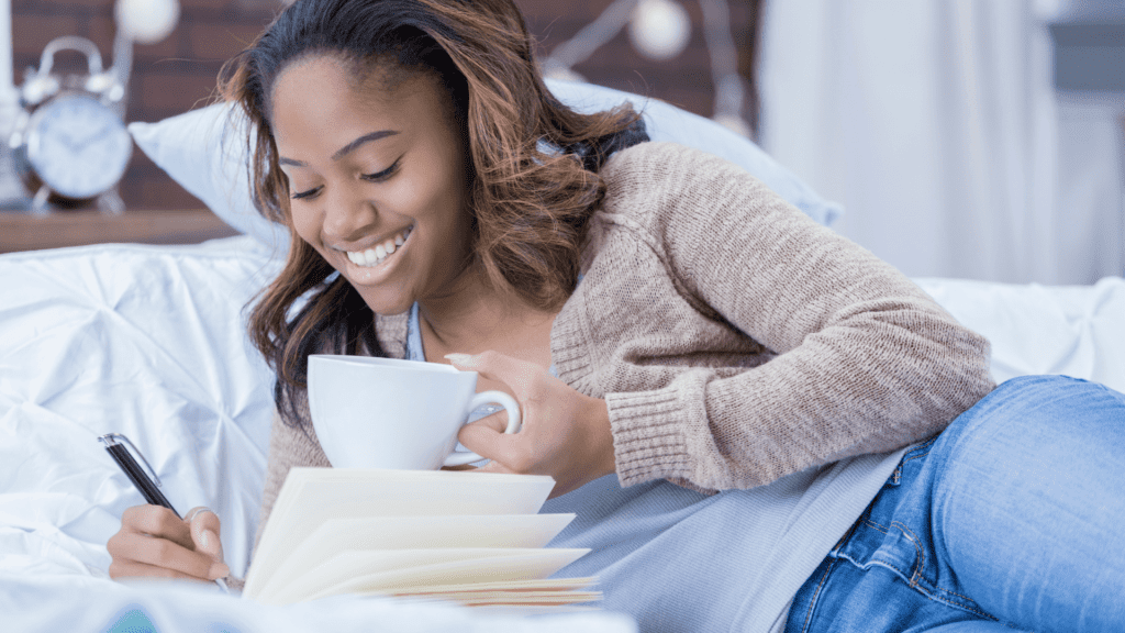 A woman enjoys a relaxing moment in bed with a cup of coffee and an activity book, engaging in puzzles like sudoku, word search, and mazes. | Mind Boost Books - Boost Brain Power with Puzzle Books & Journals