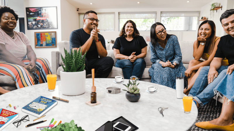 Group of people engaging in a social activity and laughing together, promoting mental fitness